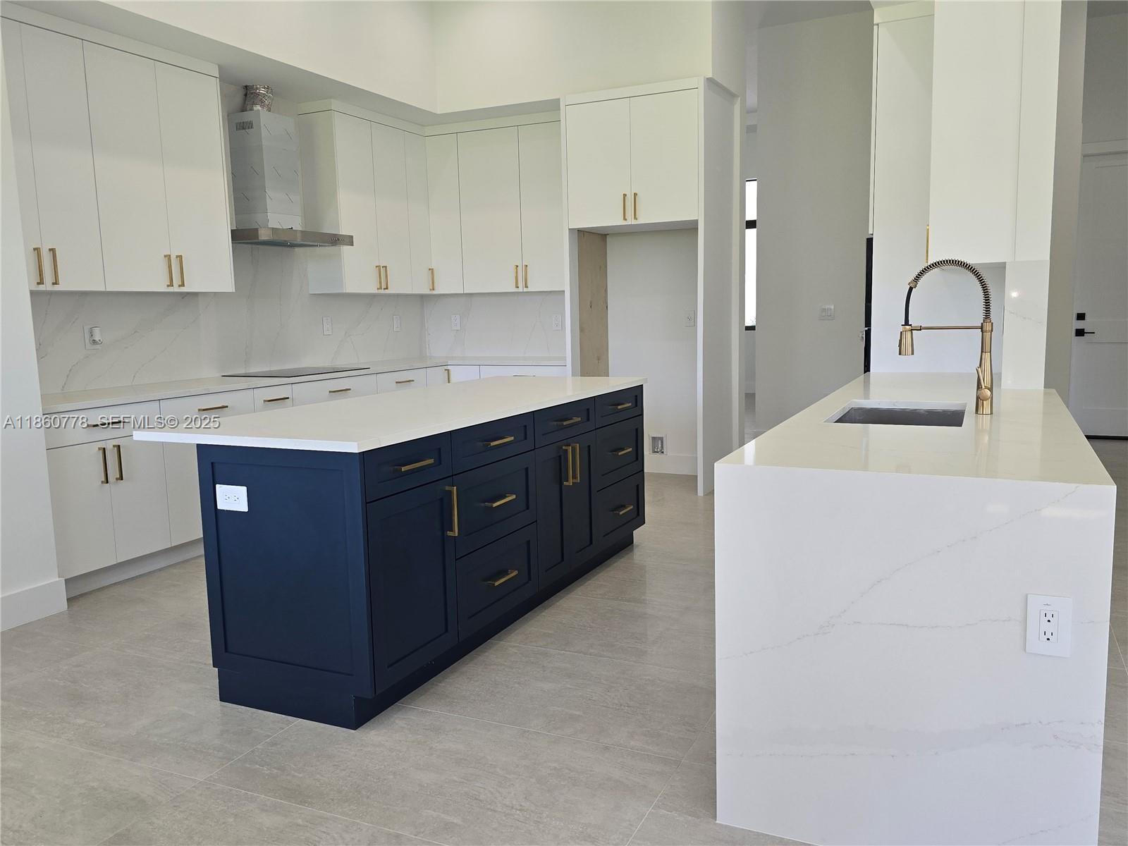 23840 Southwest 209th Place Homestead, FL 33031 - Photo 58 of 89 a kitchen with a sink a stove and cabinets