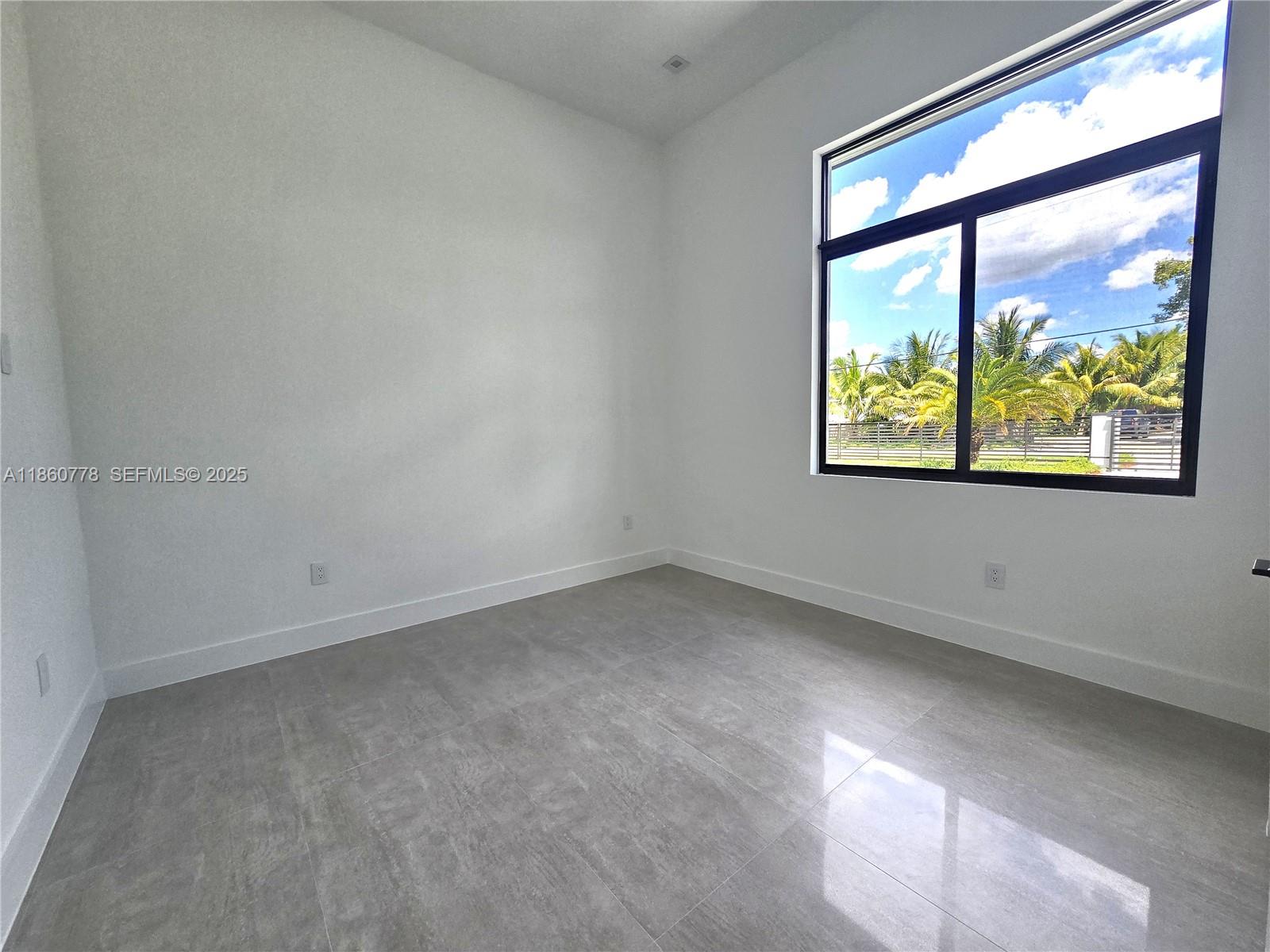 23840 Southwest 209th Place Homestead, FL 33031 - Photo 63 of 89 an empty room with a window