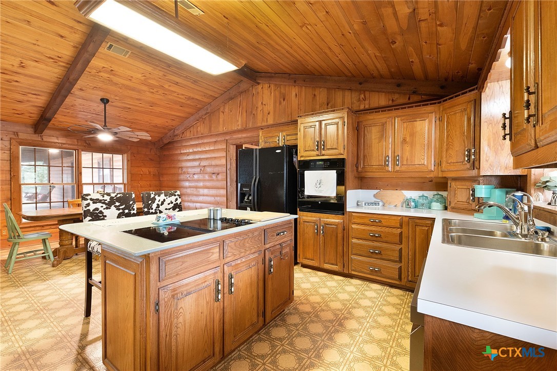 124 Old Mission Road Kempner, TX 76539 - Photo 12 of 39 a kitchen with sink stove and cabinets