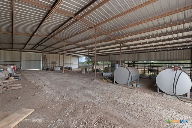 a view of a garage with table and chairs