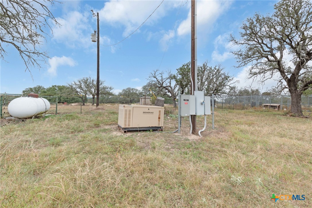 124 Old Mission Road Kempner, TX 76539 - Photo 31 of 39 a white house that has a tree in front of it