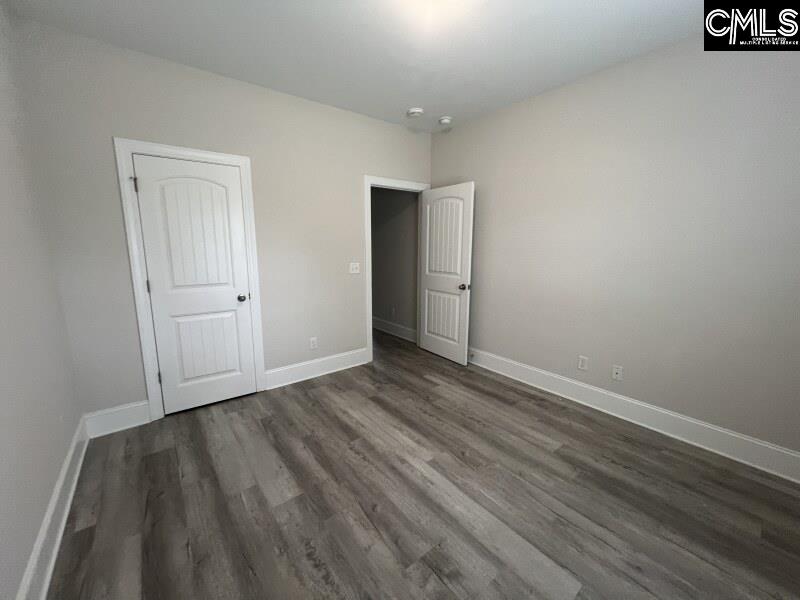 516 Mitscher Way Chapin, SC 29036 - Photo 18 of 18 a view of an empty room and wooden floor