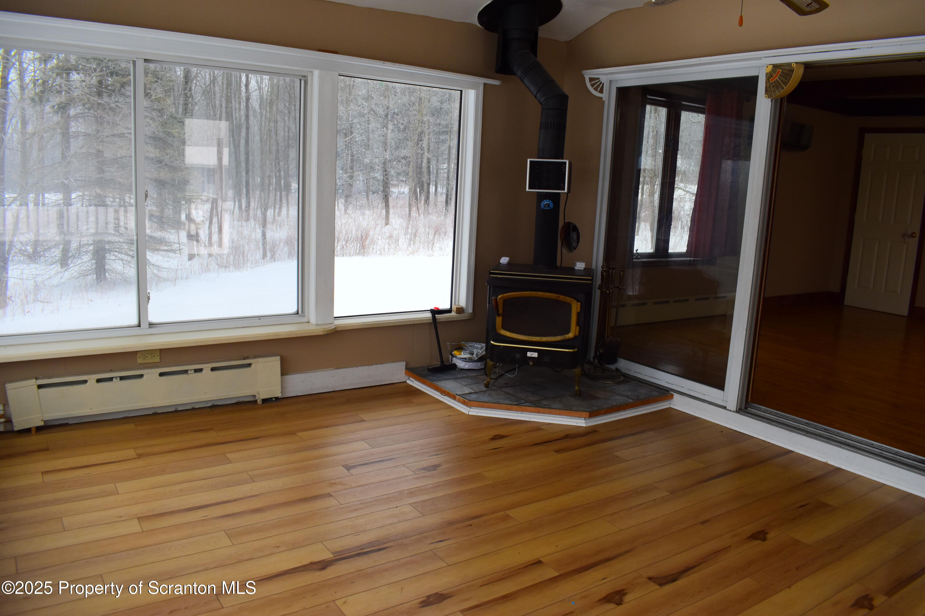 3003 Ridge Road Thompson, PA 18465 - Photo 12 of 33 a view of a room with wooden floor and window