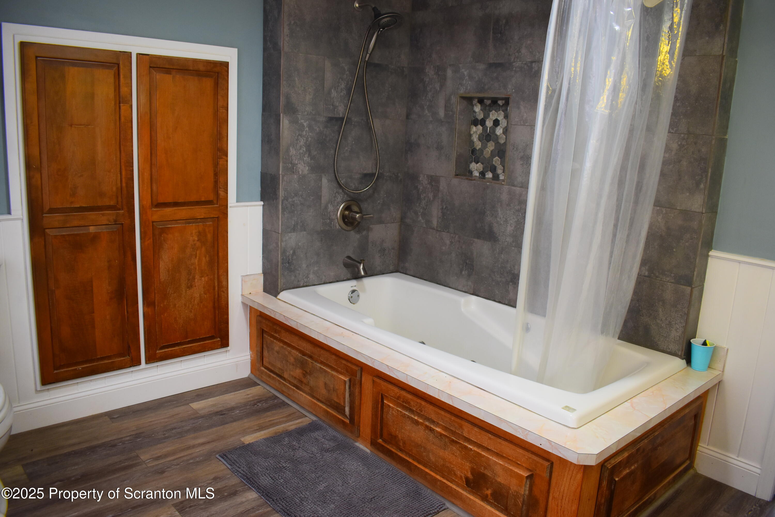 3003 Ridge Road Thompson, PA 18465 - Photo 19 of 33 a bathroom with a tub and a sink