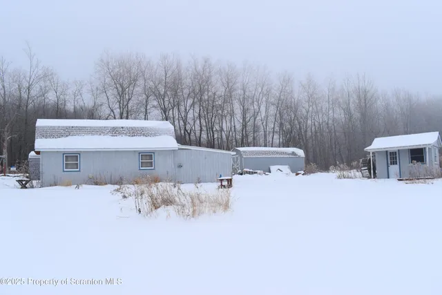 a bathroom with a sink and a chair