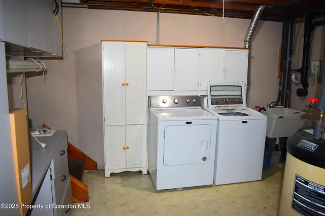 a view of storage and utility room with washer and dryer