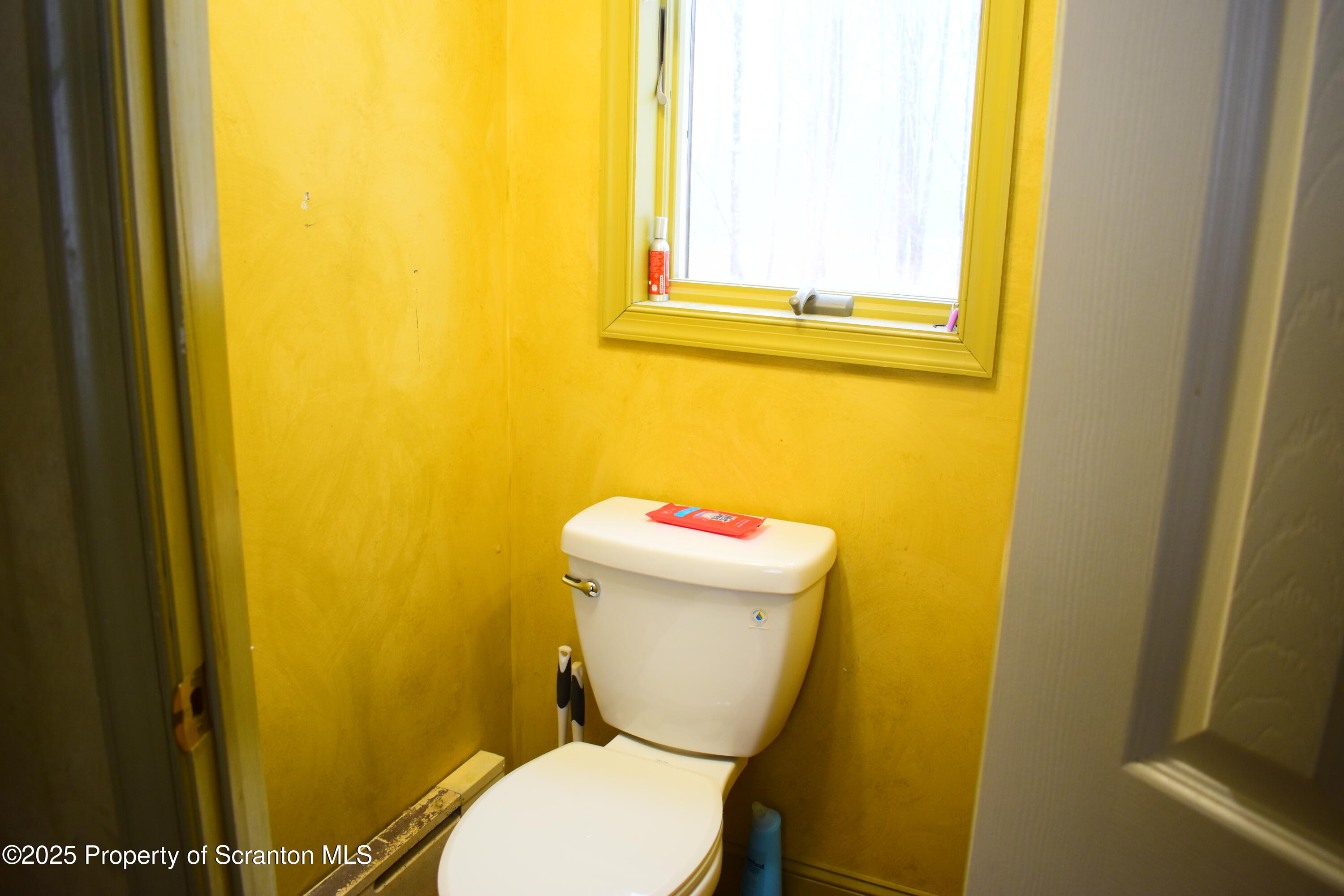 3003 Ridge Road Thompson, PA 18465 - Photo 26 of 33 a white toilet sitting next to a blue wall