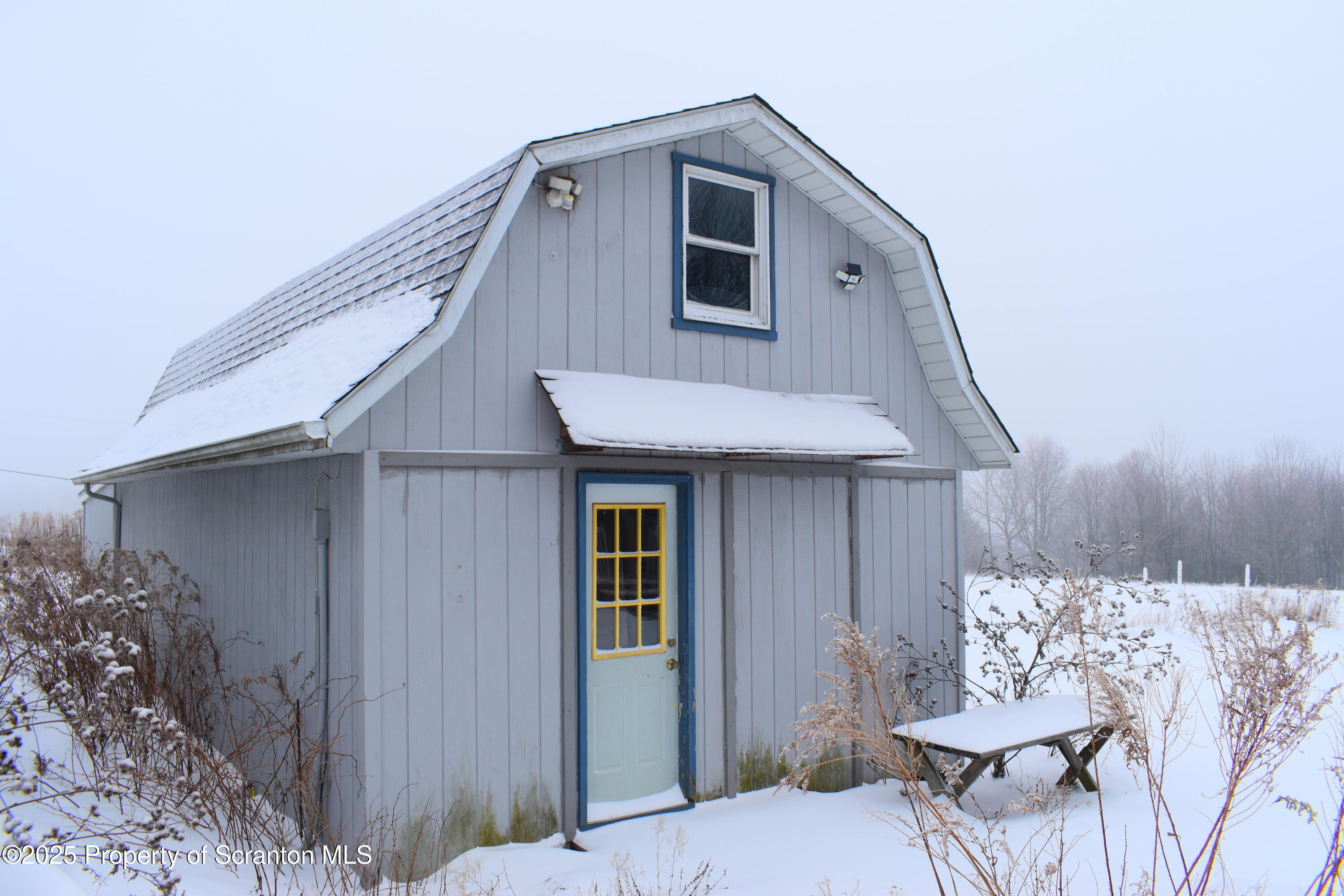 3003 Ridge Road Thompson, PA 18465 - Photo 28 of 33 a front view of a house with a yard