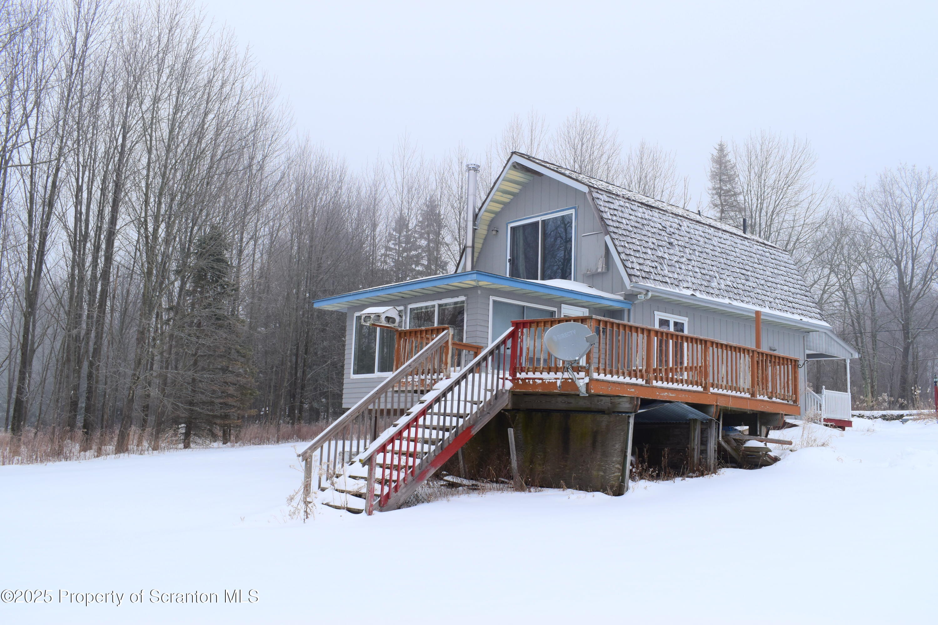 3003 Ridge Road Thompson, PA 18465 - Photo 33 of 33 a view of a house with a yard