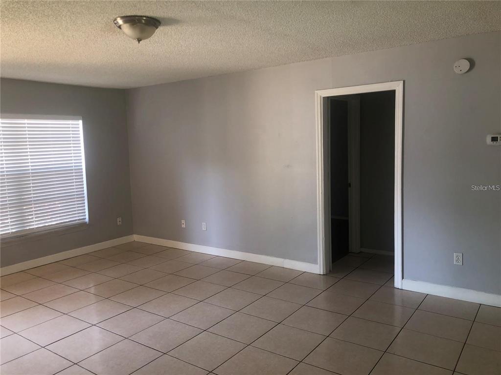 3651 North Goldenrod Road, Unit E103 Winter Park, FL 32792 - Photo 5 of 7 an empty room with windows