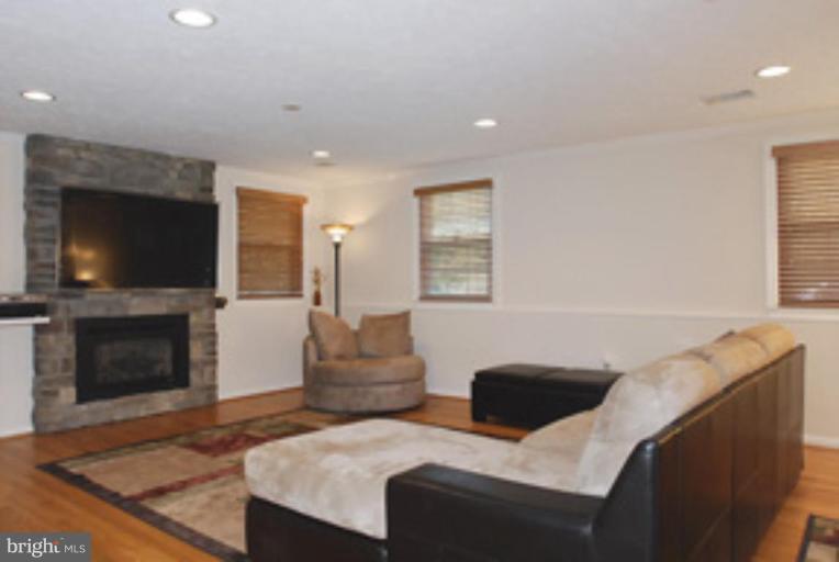 12621 Billington Road Silver Spring, MD 20904 - Photo 12 of 30 Family Room with Gas Fireplace with Stone Mantle
