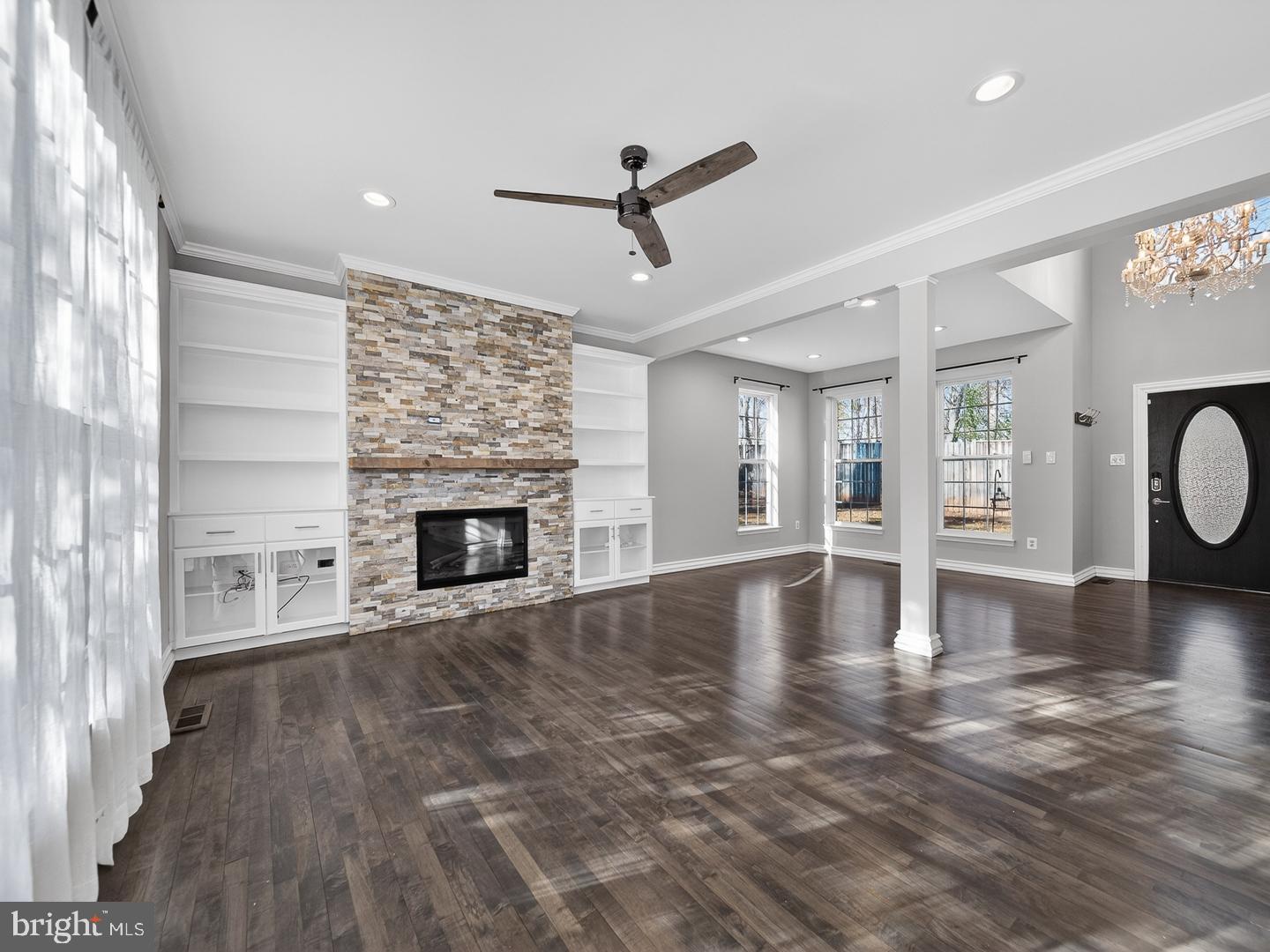 9534 Fernwood Road Bethesda, MD 20817 - Photo 14 of 44 a view of empty room with wooden floor and fireplace