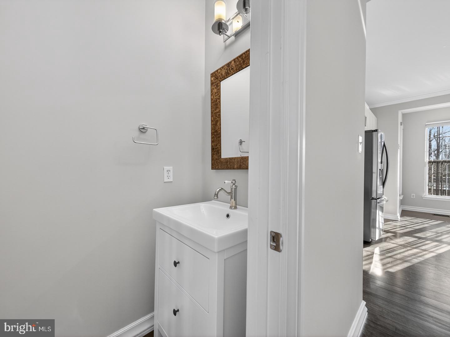 9534 Fernwood Road Bethesda, MD 20817 - Photo 15 of 44 a bathroom with a sink and a mirror