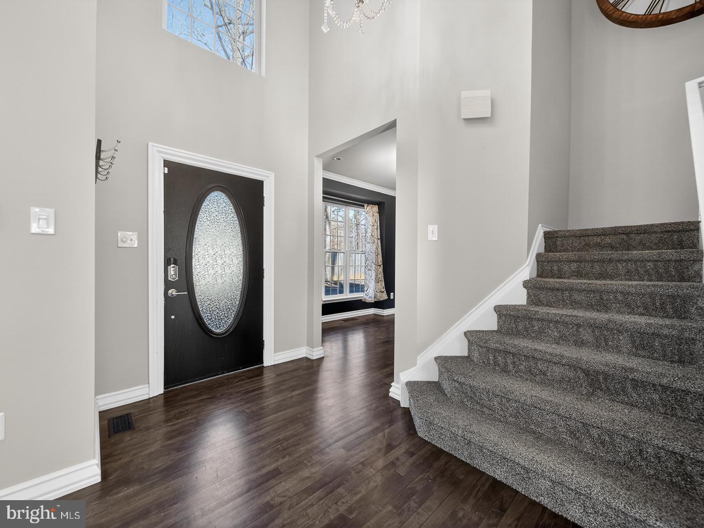 9534 Fernwood Road Bethesda, MD 20817 - Photo 17 of 44 a view of a hallway with wooden floor and floors