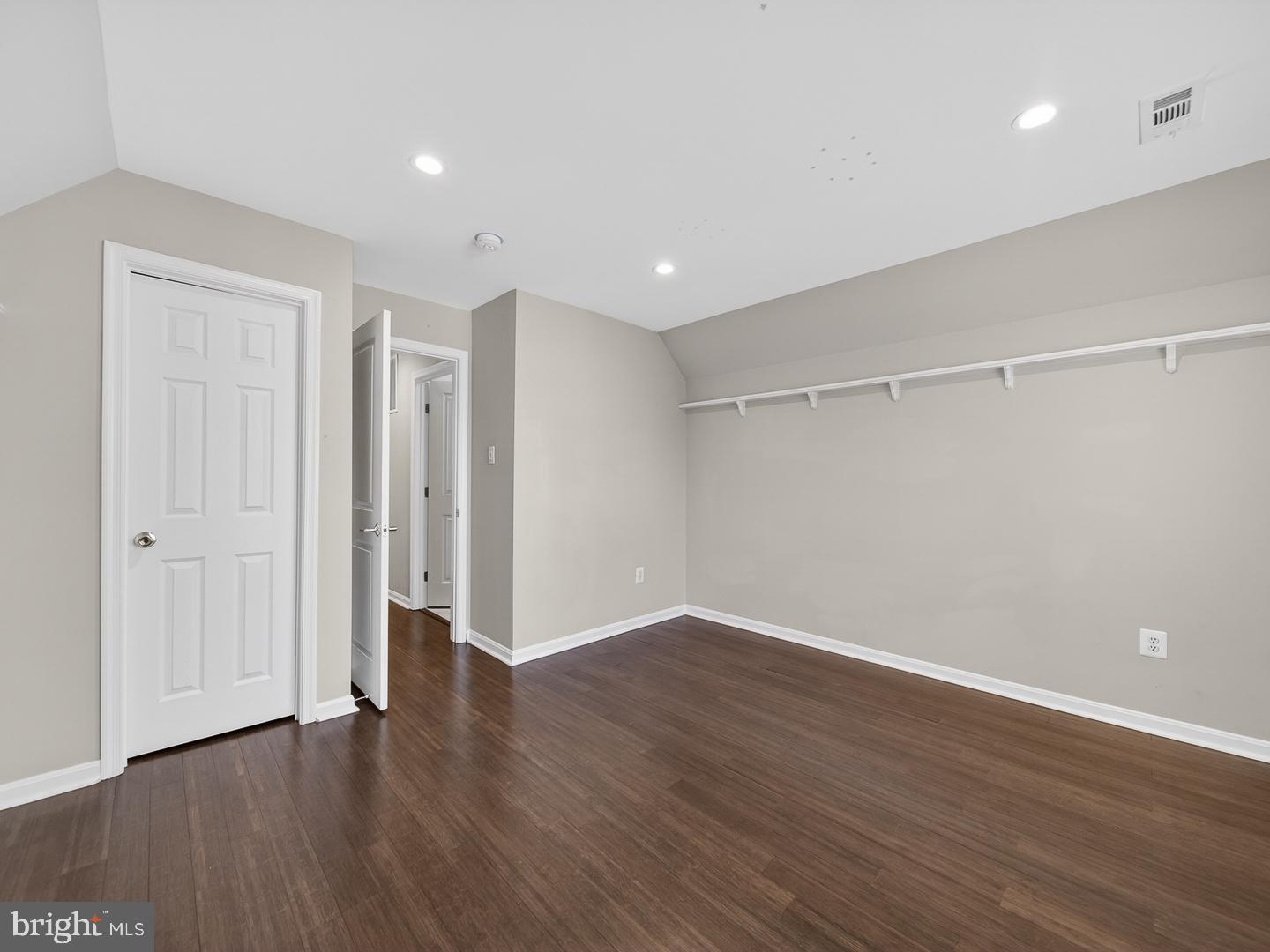 9534 Fernwood Road Bethesda, MD 20817 - Photo 32 of 44 a view of an empty room with wooden floor