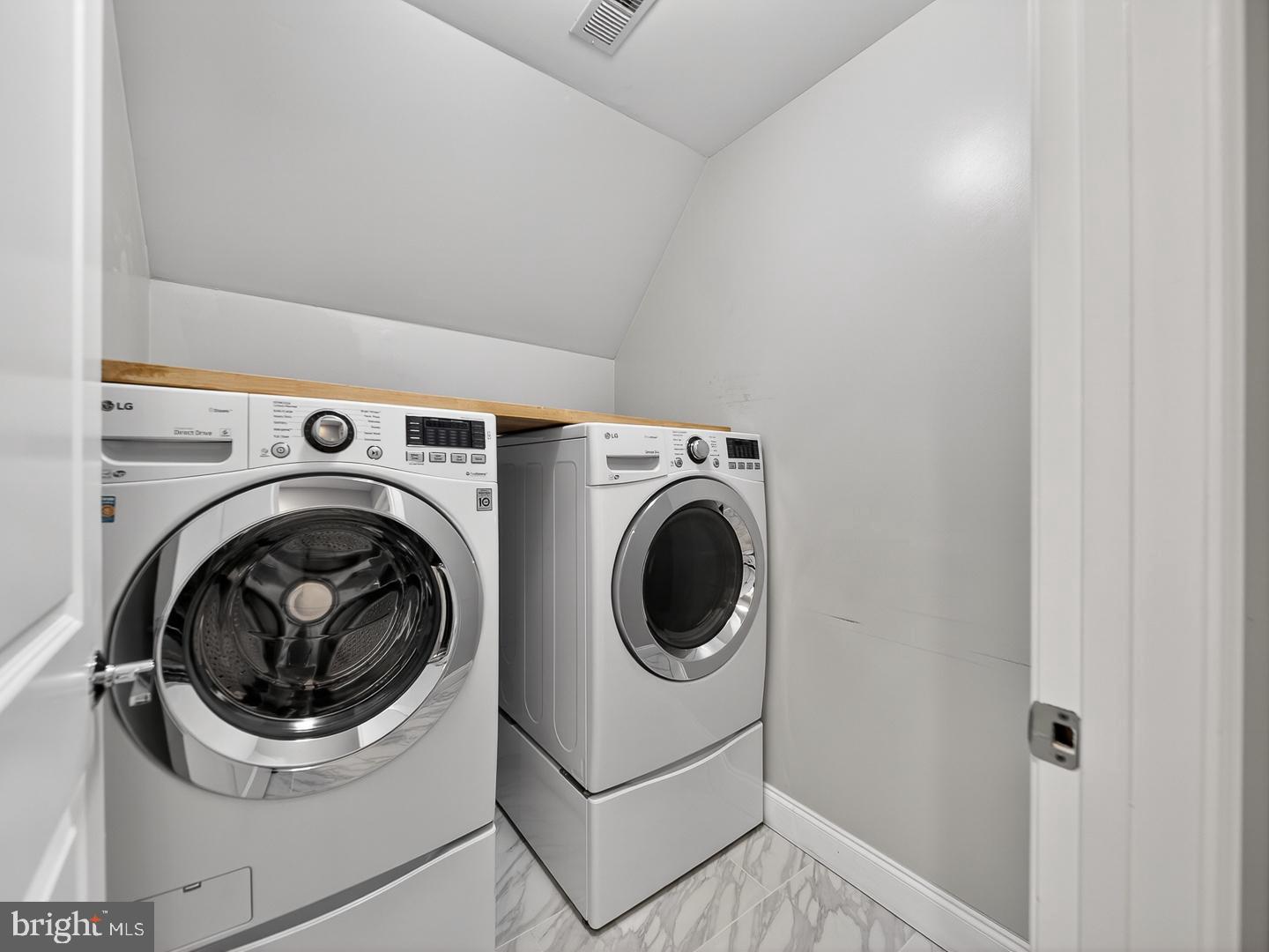 9534 Fernwood Road Bethesda, MD 20817 - Photo 33 of 44 a utility room with dryer and washer