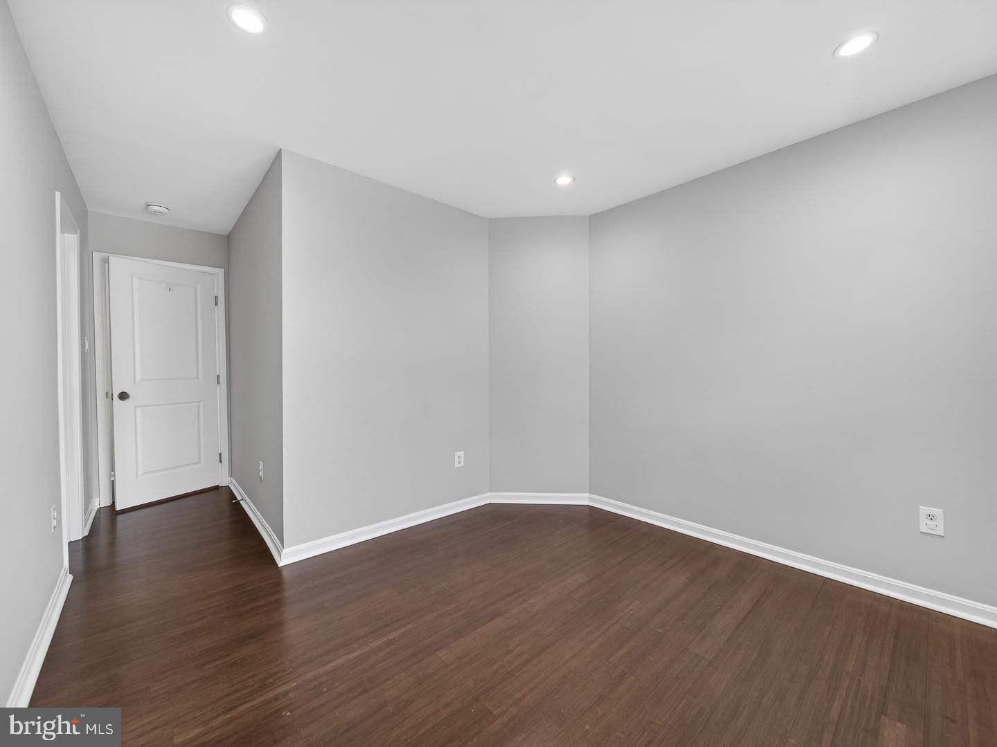 9534 Fernwood Road Bethesda, MD 20817 - Photo 36 of 44 a view of an empty room with wooden floor
