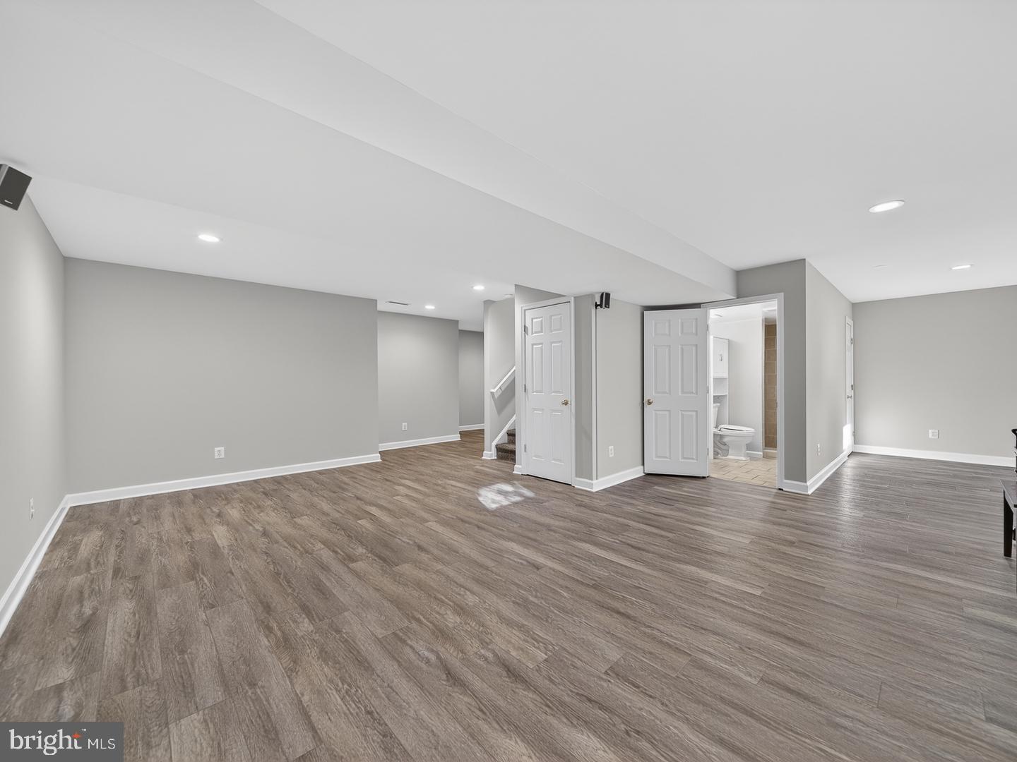 9534 Fernwood Road Bethesda, MD 20817 - Photo 38 of 44 a view of an empty room with wooden floor
