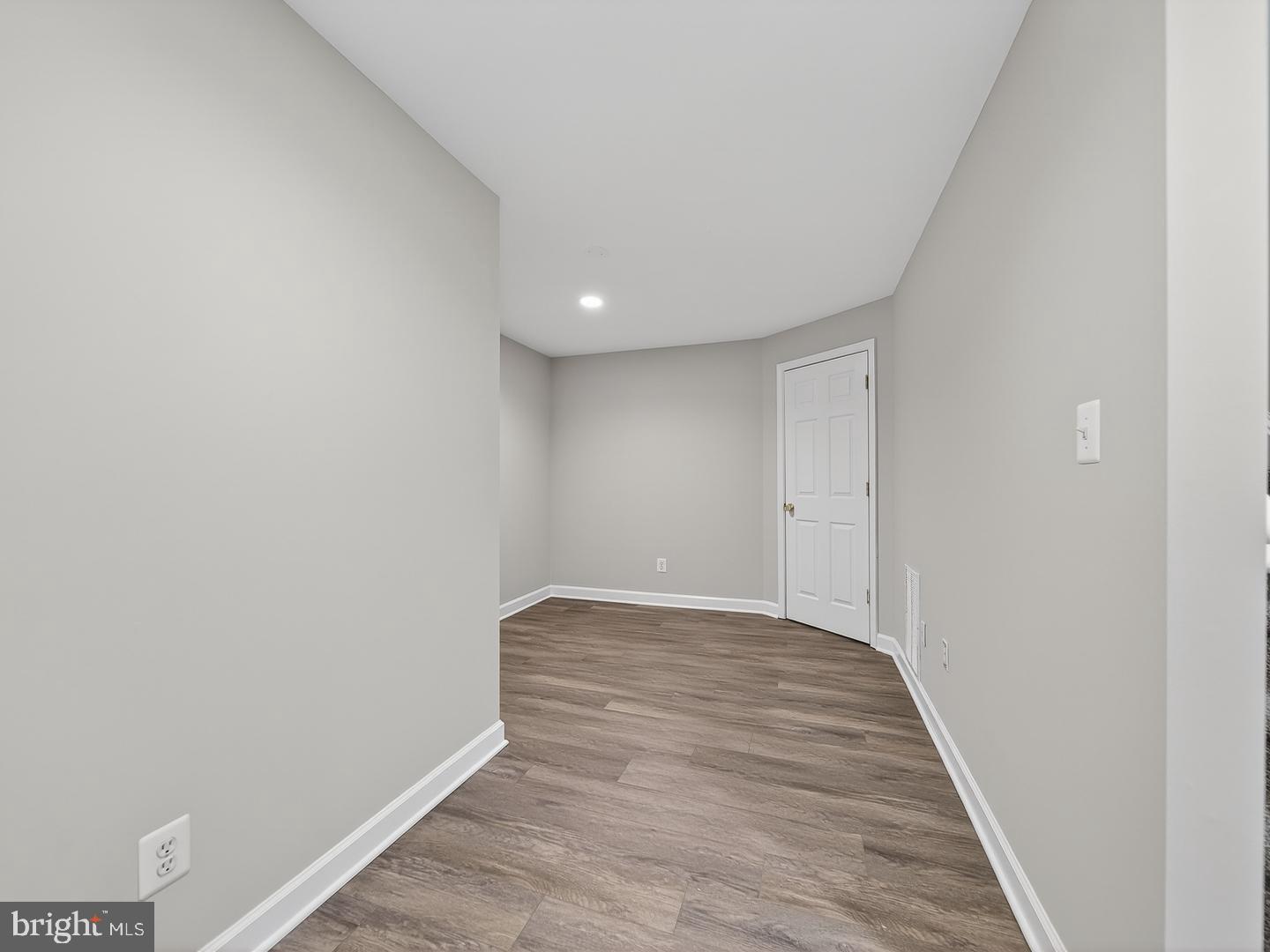 9534 Fernwood Road Bethesda, MD 20817 - Photo 41 of 44 a view of an empty room and wooden floor