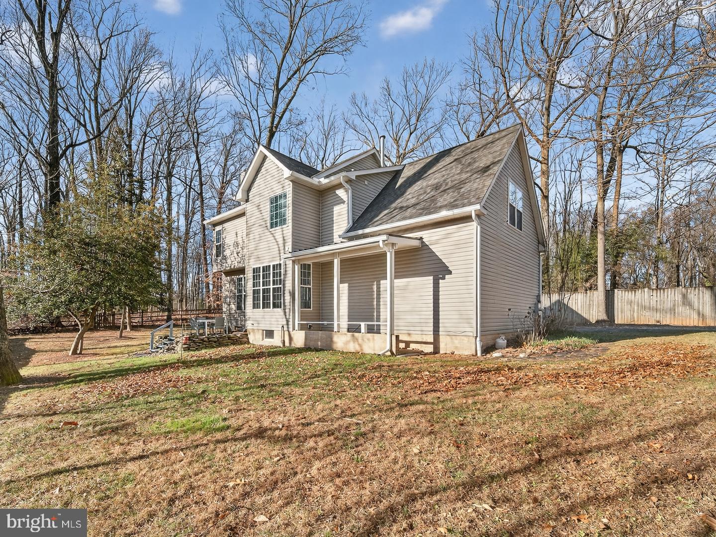 9534 Fernwood Road Bethesda, MD 20817 - Photo 42 of 44 a front view of a house with a yard covered with snow