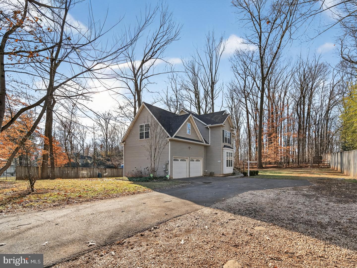 9534 Fernwood Road Bethesda, MD 20817 - Photo 44 of 44 a front view of a house with a yard and garage
