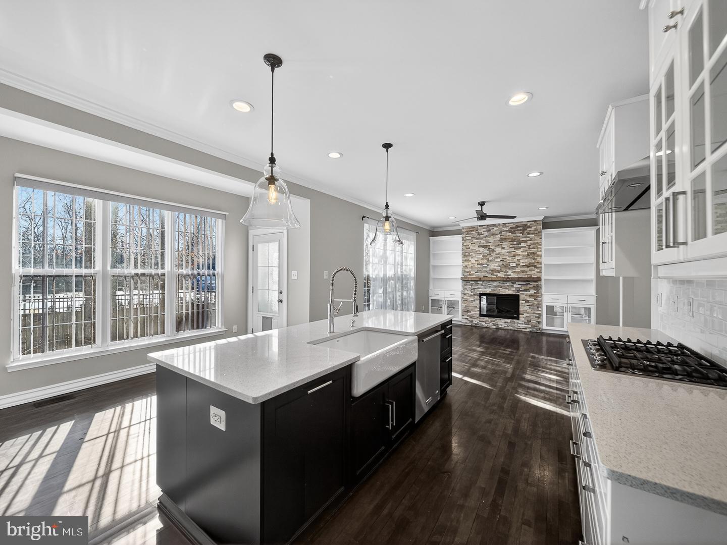 9534 Fernwood Road Bethesda, MD 20817 - Photo 5 of 44 a large kitchen with kitchen island a large counter space a sink appliances and a window