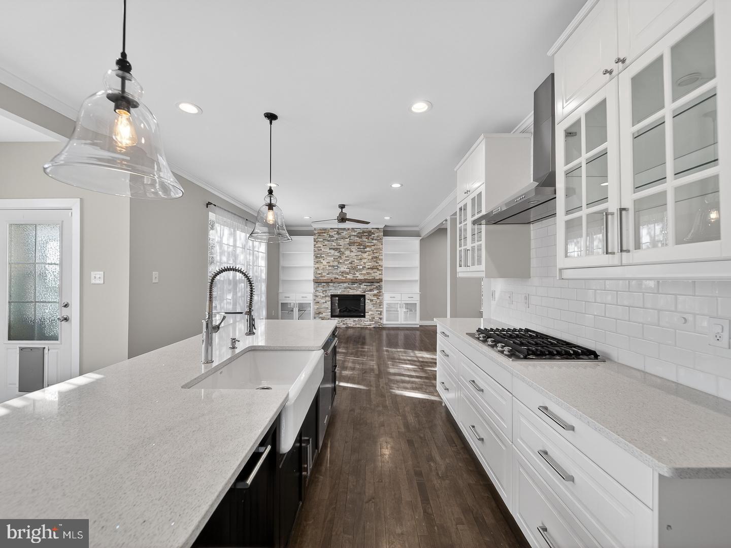9534 Fernwood Road Bethesda, MD 20817 - Photo 6 of 44 a kitchen with cabinets and stove top oven