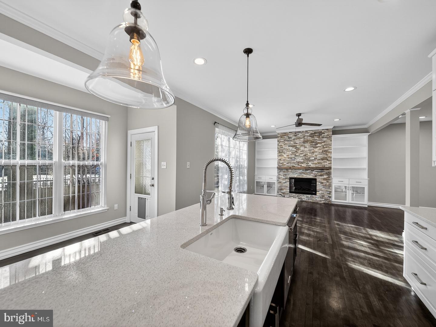 9534 Fernwood Road Bethesda, MD 20817 - Photo 7 of 44 a view of a dining room with furniture wooden floor potted plant and a chandelier