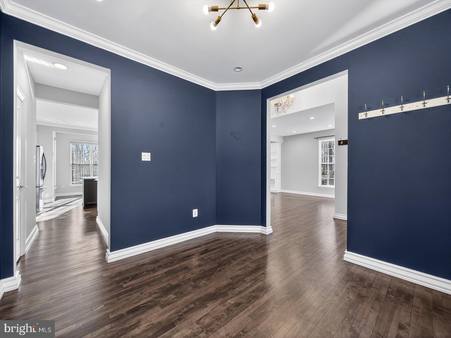 9534 Fernwood Road Bethesda, MD 20817 - Photo 9 of 44 wooden floor in an empty room with a window