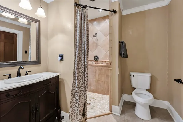 a bathroom with a toilet sink and shower