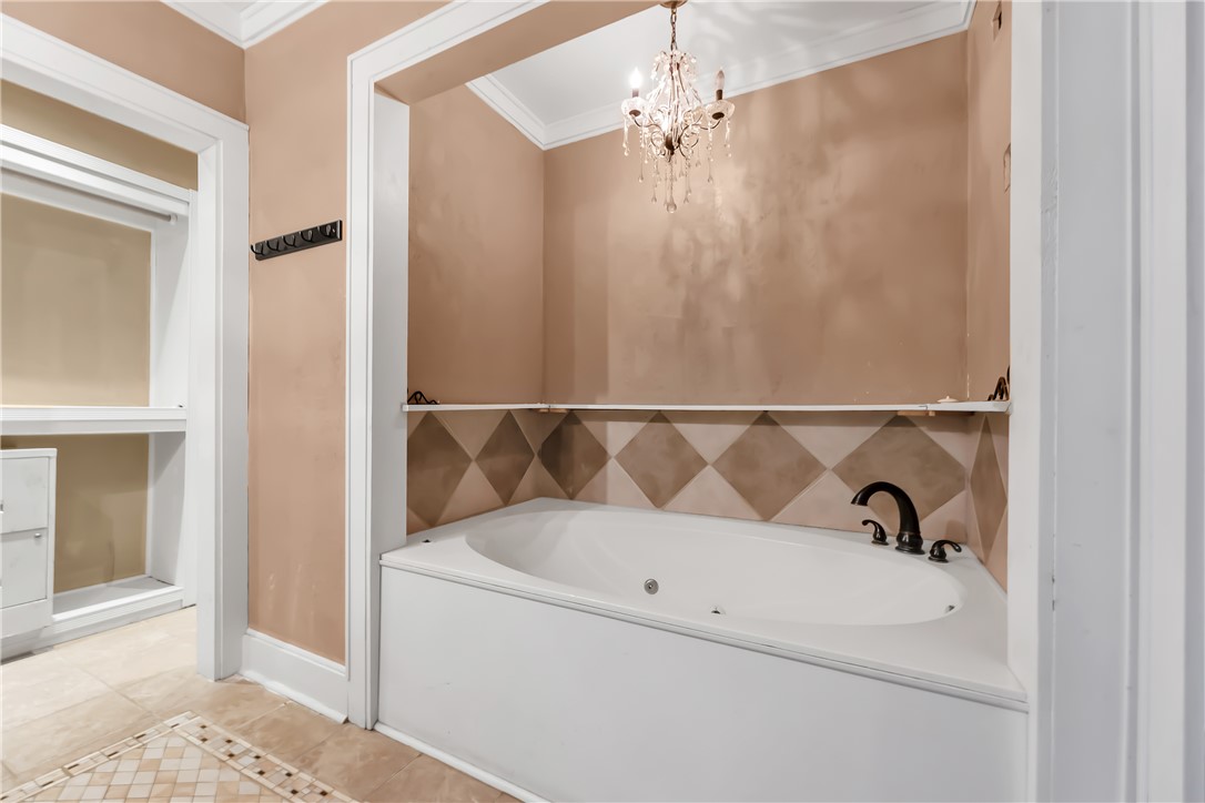 800 South Ennis Street Bryan, TX 77803 - Photo 18 of 38 a bathroom with a bathtub