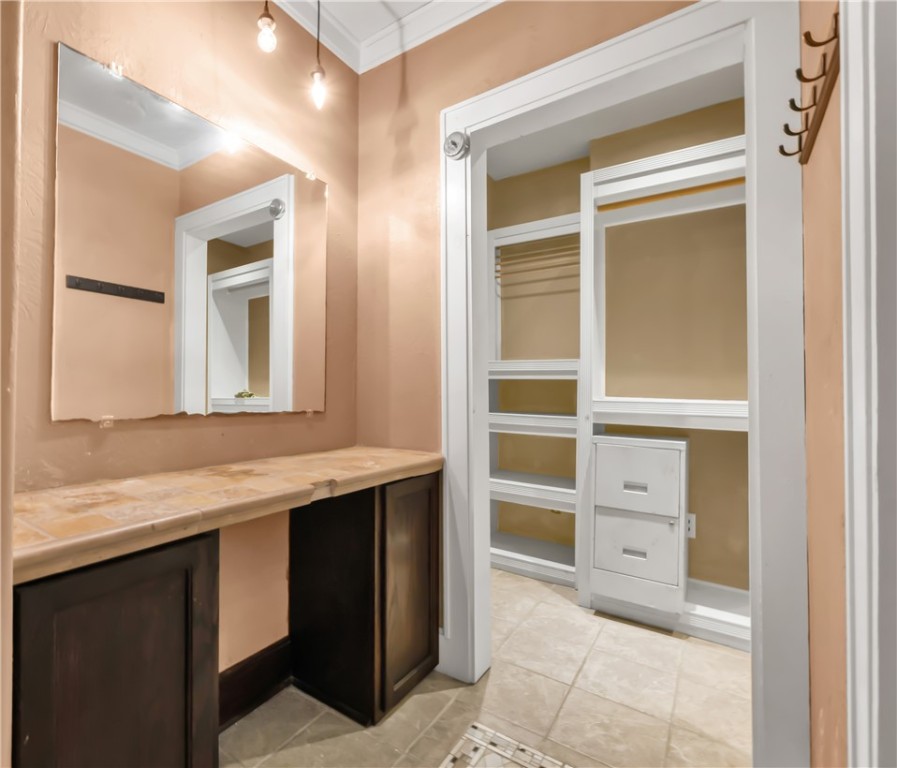 800 South Ennis Street Bryan, TX 77803 - Photo 19 of 38 a bathroom with a sink a vanity and a mirror