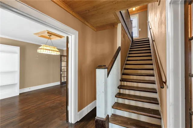 a view of an entryway with wooden floor