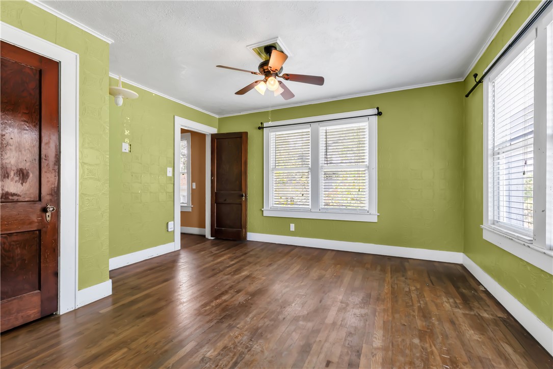 800 South Ennis Street Bryan, TX 77803 - Photo 22 of 38 a view of an empty room with wooden floor and a window
