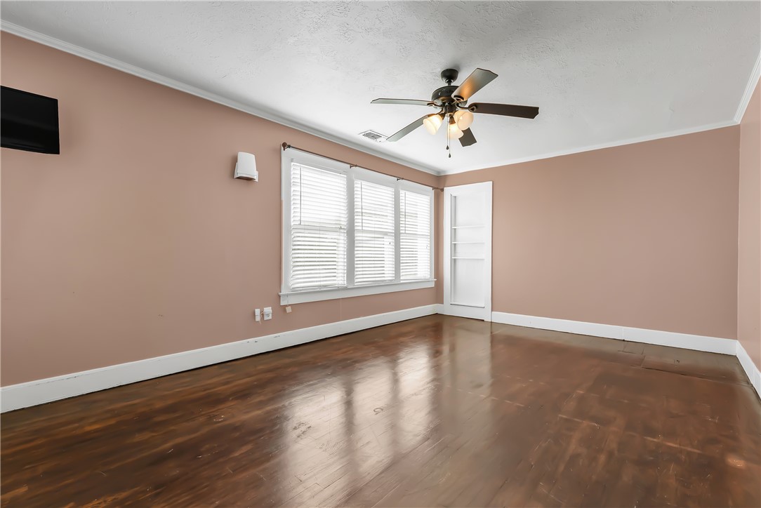 800 South Ennis Street Bryan, TX 77803 - Photo 26 of 38 a view of an empty room with wooden floor and a window
