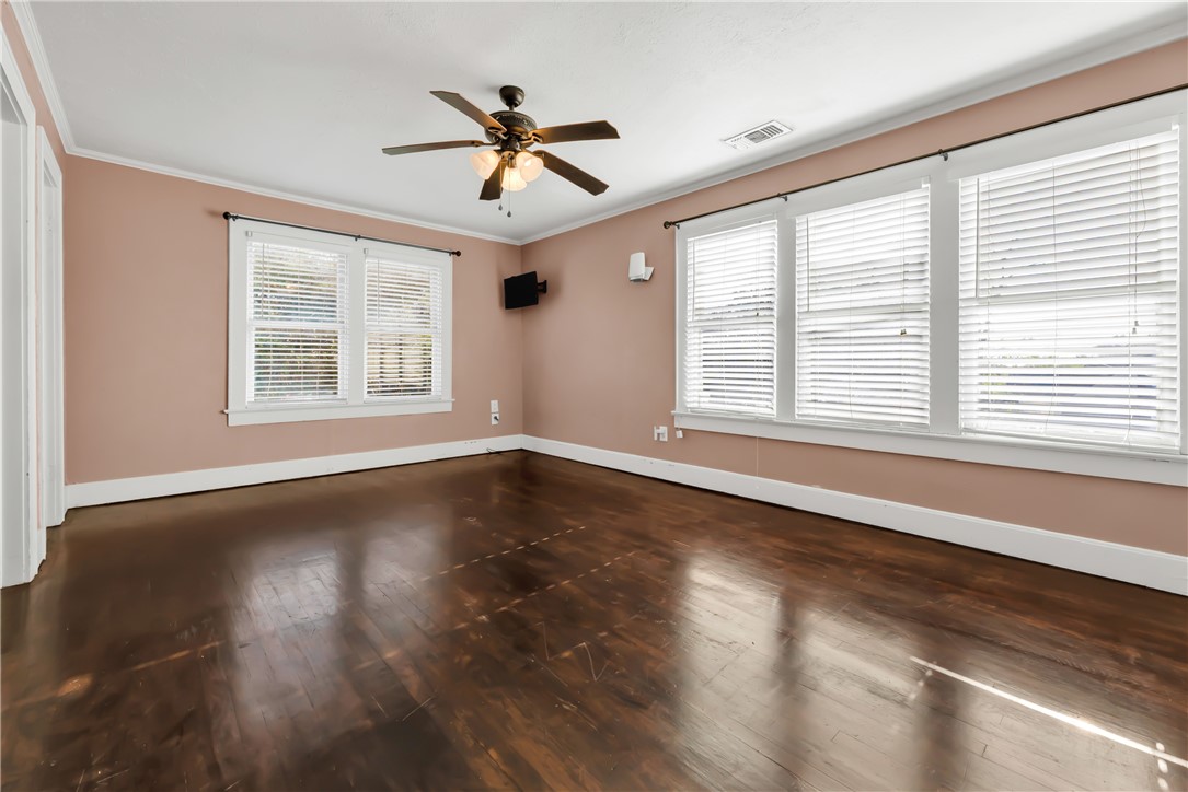 800 South Ennis Street Bryan, TX 77803 - Photo 27 of 38 a view of an empty room with wooden floor and a window