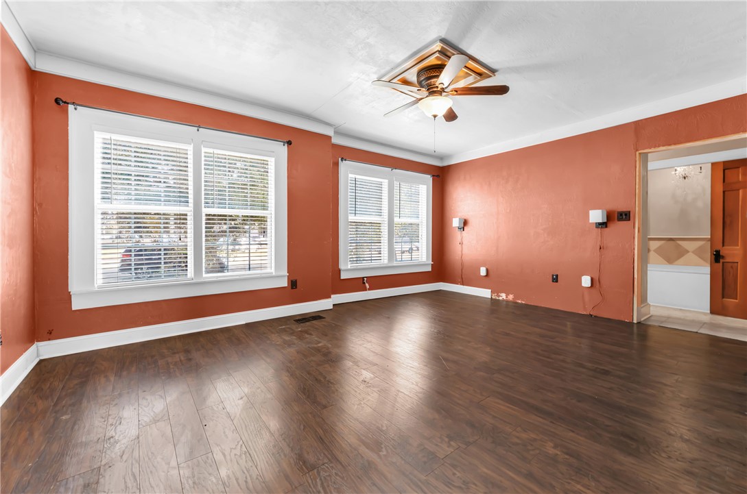 800 South Ennis Street Bryan, TX 77803 - Photo 8 of 38 a view of an empty room with wooden floor and a window