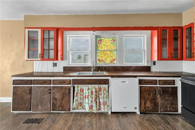 a kitchen with stainless steel appliances granite countertop a stove and a sink