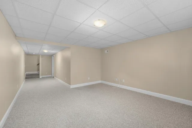 an empty room with a empty space and windows