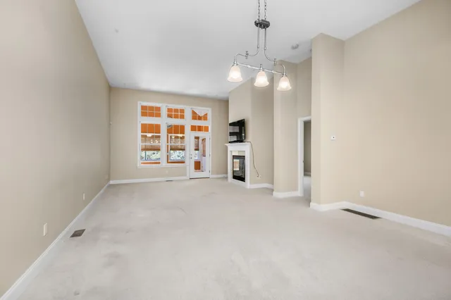 a kitchen with granite countertop a sink and cabinets