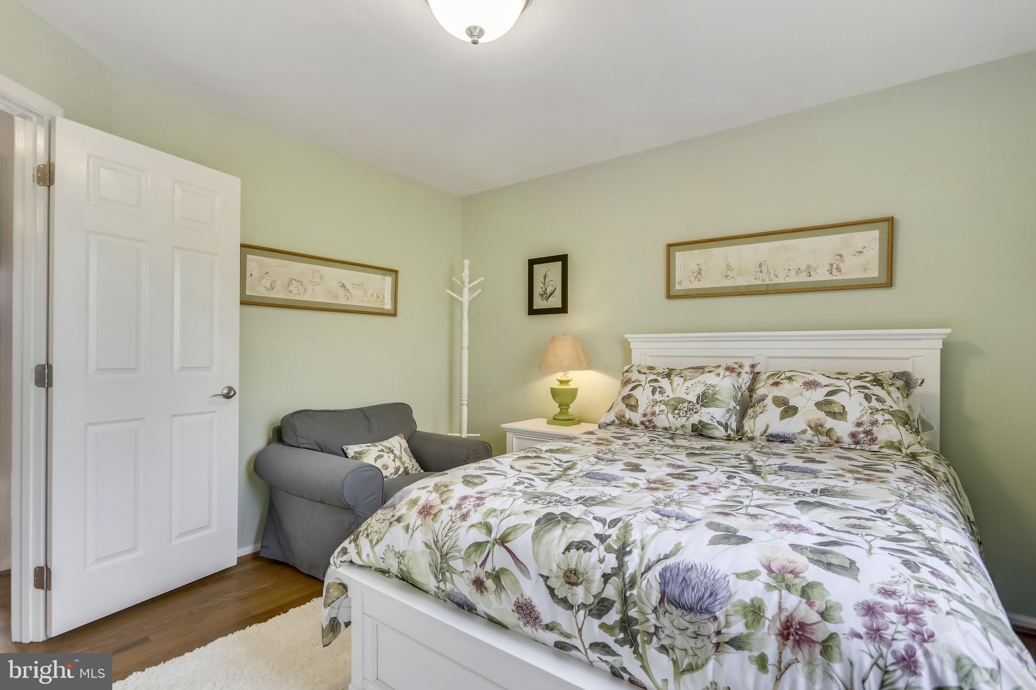 10783 Kinloch Road Silver Spring, MD 20903 - Photo 18 of 43 a bed sitting in a bedroom and painting on the wall