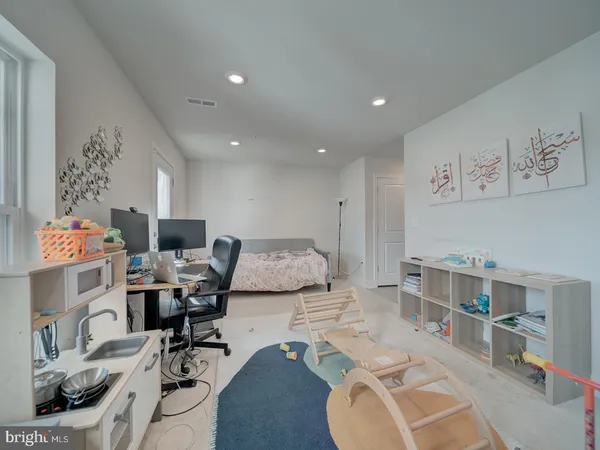a workspace with furniture and white walls