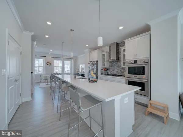 a kitchen with a table and chairs in it