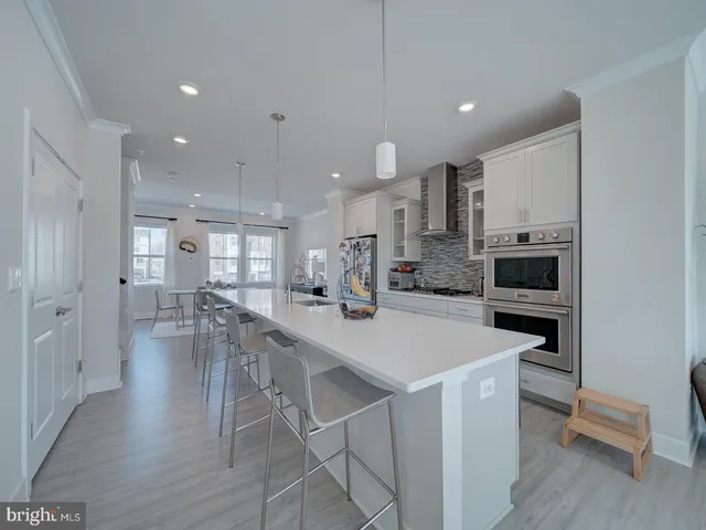 a kitchen with a table and chairs in it
