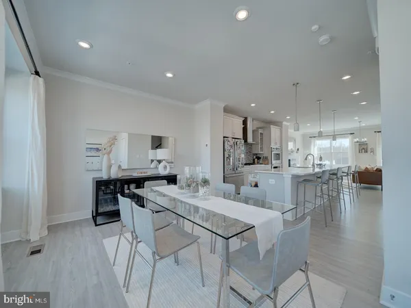 a view of kitchen with kitchen island and stainless steel appliances