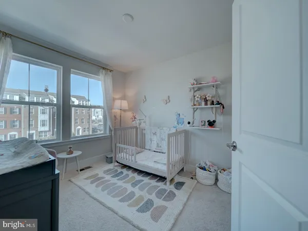 a bathroom with a tub sink toilet and window