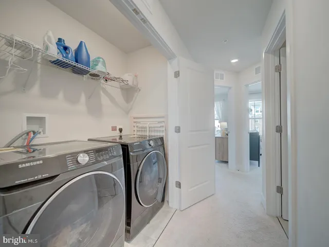 a view of a storage & utility room with washer and dryer