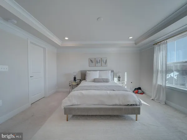 a bedroom with bed and window