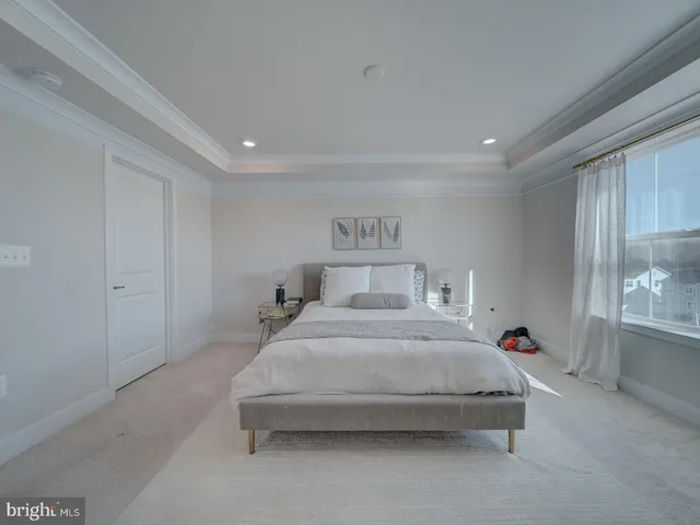 a bedroom with bed and window