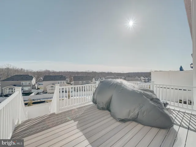 a view of roof deck with outdoor seating and city view